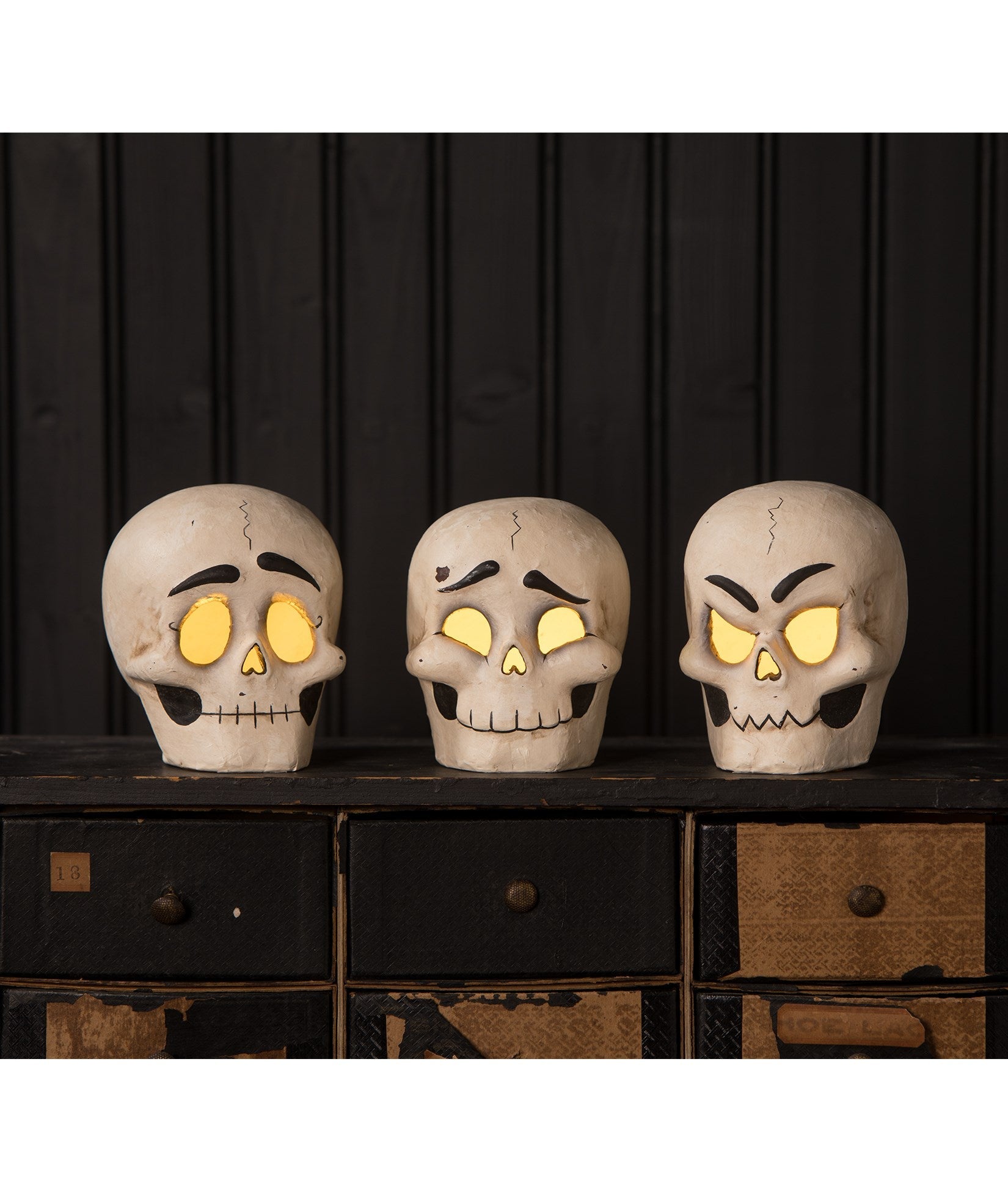 "Skully Head Luminaries, paper mache"